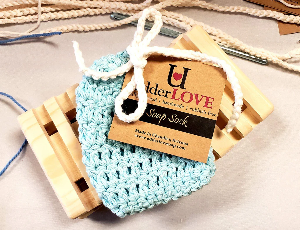 Crocheted soap sock with a wooden soap dish